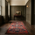 Red Persian runner rug in a hallway