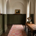 Brown Persian runner rug in a corridor