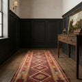 Brown Persian runner rug in a den