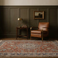 Red Persian rug in a styled room