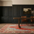 Red Persian rug in a dining room