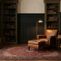 Red Persian rug in a library