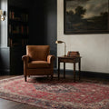 Red Persian rug in a library