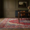 Red Persian rug in a dining room