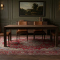 Red Persian rug in a dining room