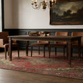 Red rug in a dining room