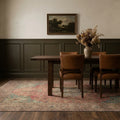 Red rug in a dining room