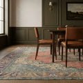 Red rug in a dining room