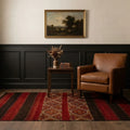 Red Turkish kilim rug in a den