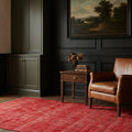 Red Turkish rug in a study