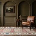 Red Turkish rug in a study