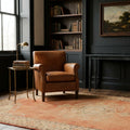 Red Turkish rug in a study