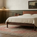 Red Turkish rug in a bedroom