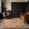 Orange Turkish rug in a styled room