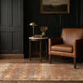 Orange Turkish rug in a bedroom