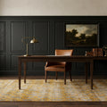 Yellow Turkish rug in a study