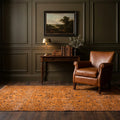 Orange Turkish rug in a study