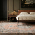 Orange Turkish rug in a bedroom