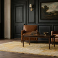 Yellow Turkish rug in a den