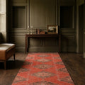 Red Turkish runner rug in a den