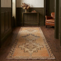 Beige Turkish runner rug in a hallway