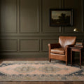 Brown Turkish runner rug in a study