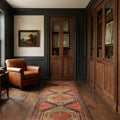 Red Turkish runner rug in a study