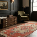 Red Turkish runner rug in a den