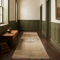 Beige Turkish runner rug in a hallway