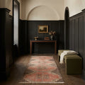 Red Turkish runner rug in a hallway
