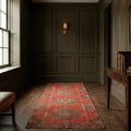 Red Turkish runner rug in a study