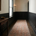 Pink Turkish runner rug in an entryway