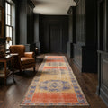 Orange Turkish runner rug in a library