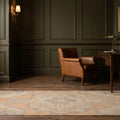 Orange Turkish runner rug in a study