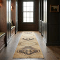 Beige Turkish runner rug in a corridor
