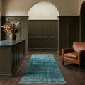 Blue Turkish runner rug in a conservatory