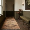 Beige Turkish runner rug in a den