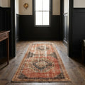 Red Turkish runner rug in a den