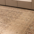 Oversized beige Persian-style wool and cotton rug with intricate geometric floral motifs in a traditional farmhouse design.