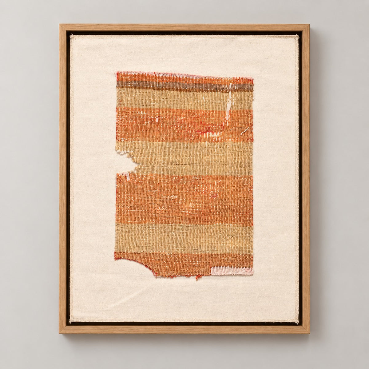 Framed vintage kilim fragment wall art in orange, khaki, sand