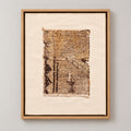 Framed vintage rug fragment wall art in brown, gold, ivory