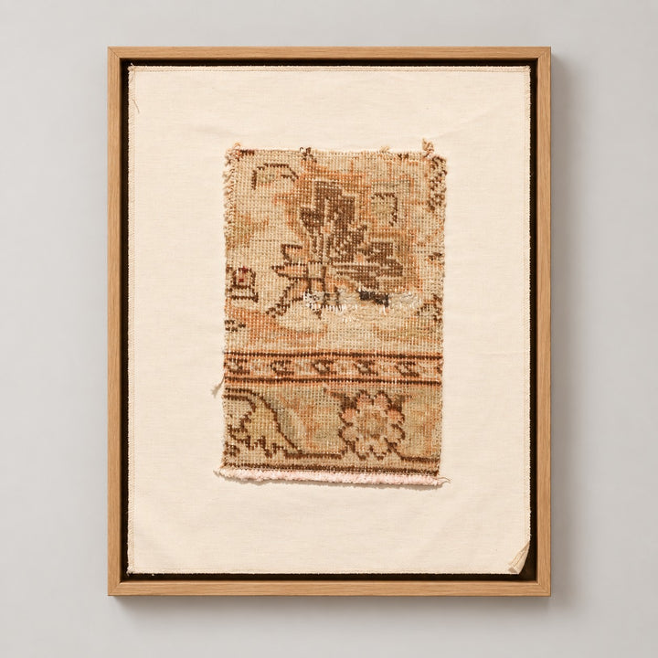 Framed vintage rug fragment wall art in beige, olive, tan