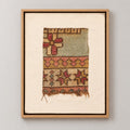 Framed vintage rug fragment wall art in pale green, rust, mustard