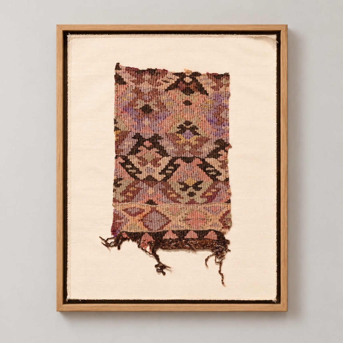 Framed vintage kilim fragment wall art in lavender, plum, brown, mustard