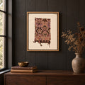 Framed vintage kilim fragment wall art in lavender, plum, brown, mustard hanging on a dark wall above a wooden console