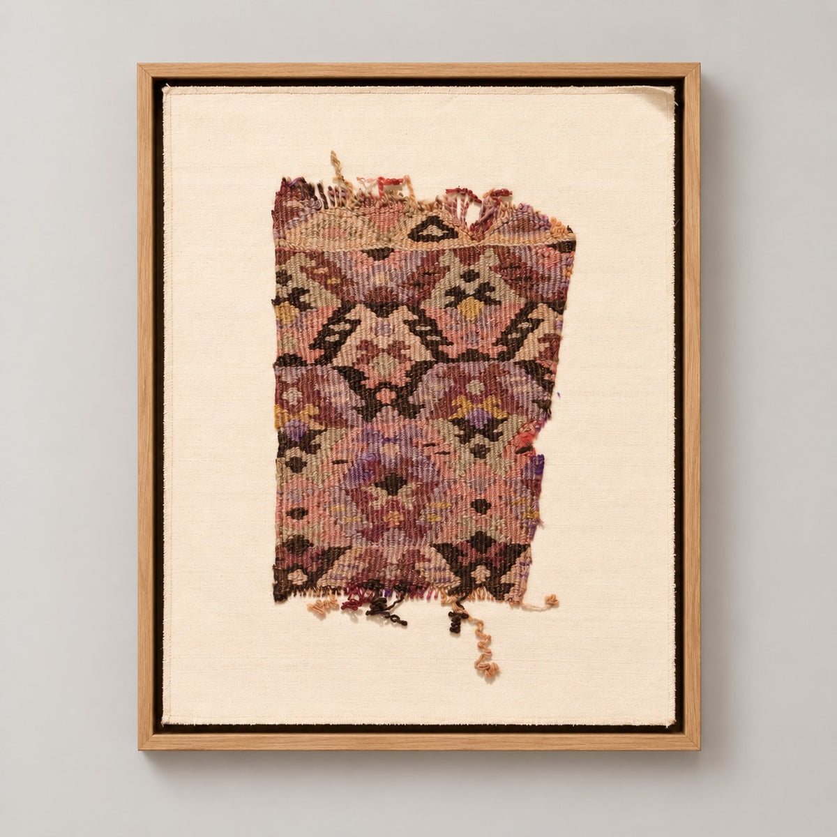 Framed vintage kilim fragment wall art in mauve, plum, ochre