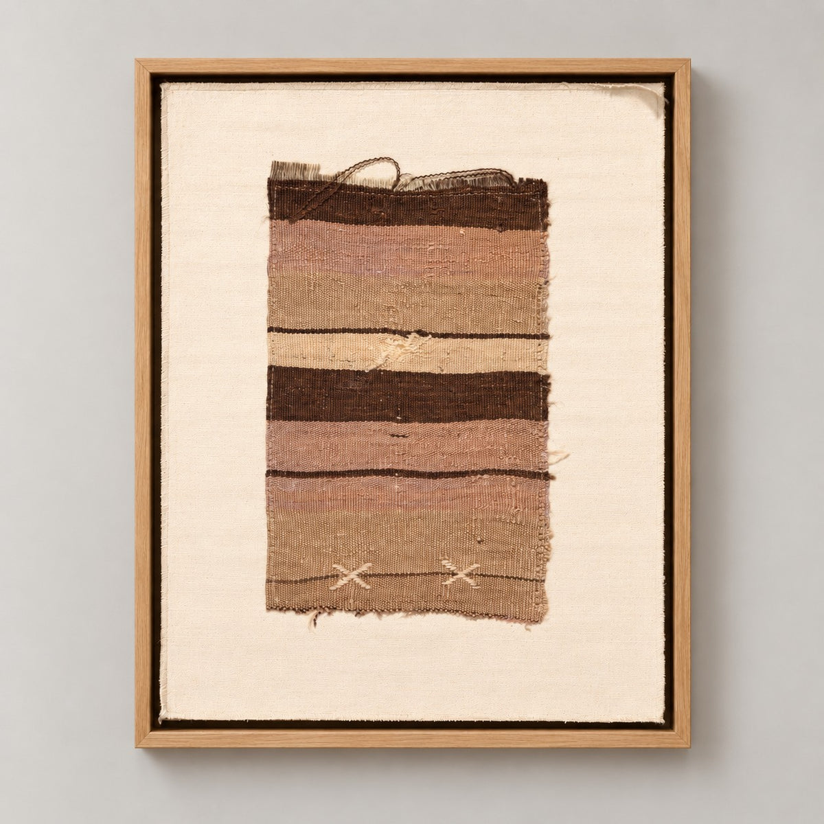 Framed vintage kilim fragment wall art in brown, taupe, ivory