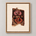 Framed vintage rug fragment wall art in dark brown, pink, orange