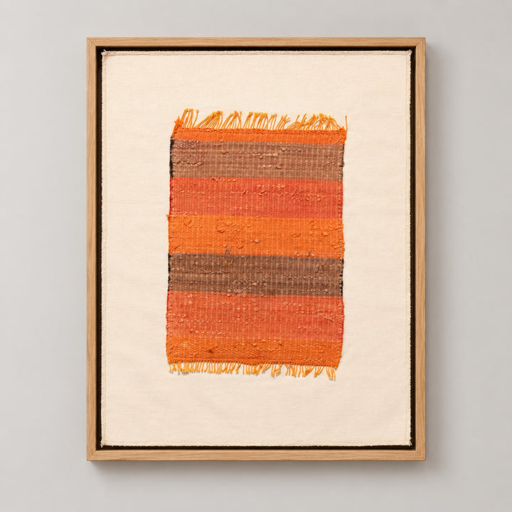 Framed vintage kilim fragment wall art in orange, taupe, brown