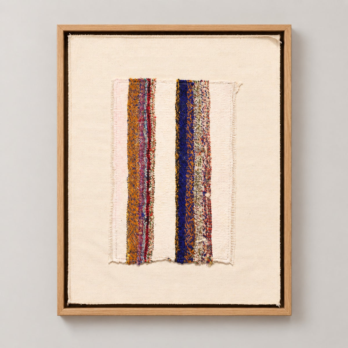 Framed vintage kilim fragment wall art in ivory, ochre, purple, navy